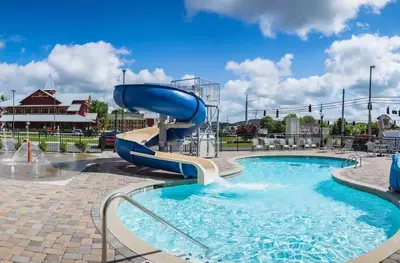 outdoor pool with water slide at Lodge at Five Oaks