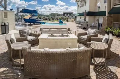 chairs outside the lodge at five oaks by the pool