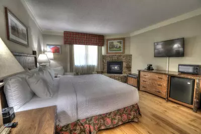 Sevierville hotel room with fireplace and king bed