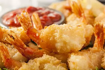 A plate of fried coconut shrimp.